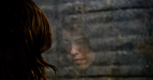 girl looking out window