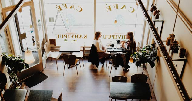 two women at table in cafe