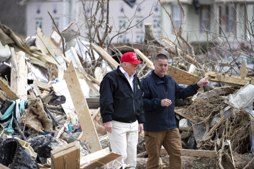 President Donald Trump speaks Mike Herrick, with Putnam County Rescue Squad