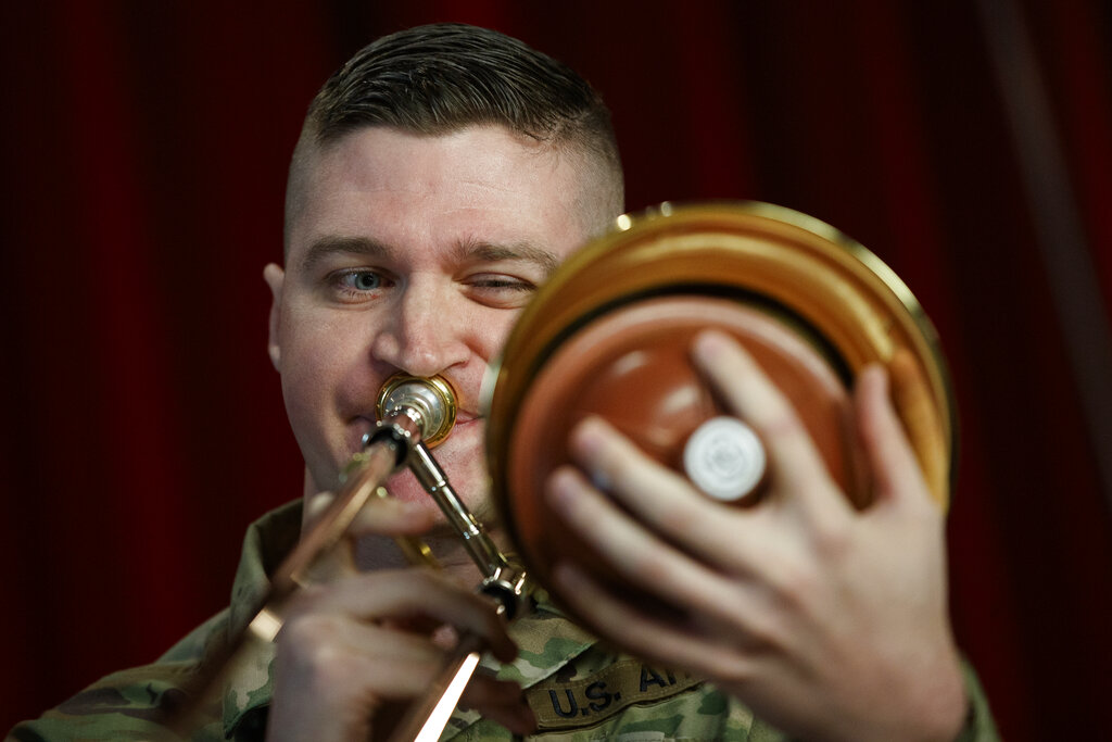 U.S. Army Field Band member Staff Sgt. Kyle Johnson, originally form College Station, Texas, plays the trombone during rehearsal of their daily "We Stand Ready" virtual concert series 