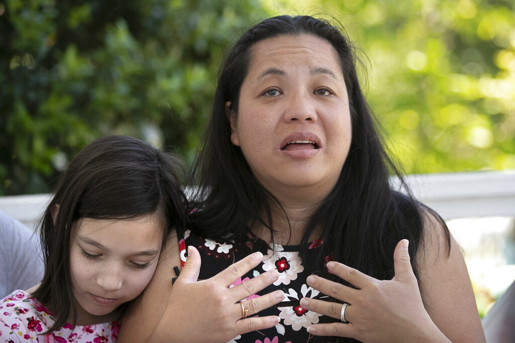 Juliet Daly, 12, sits with her mother Jennifer Daly, as she recounts the ordeal of almost losing Juliet