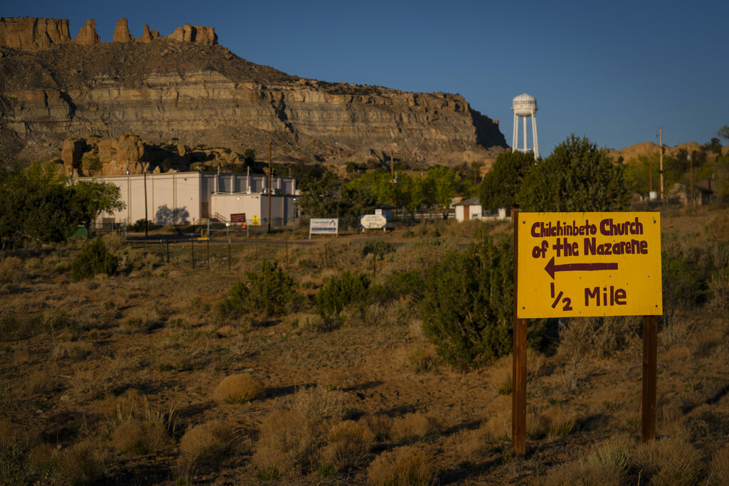 A hand-painted sign points the way to the Chilchinbeto Church of the Nazarene in Chilchinbeto, Ariz., on the Navajo reservation 