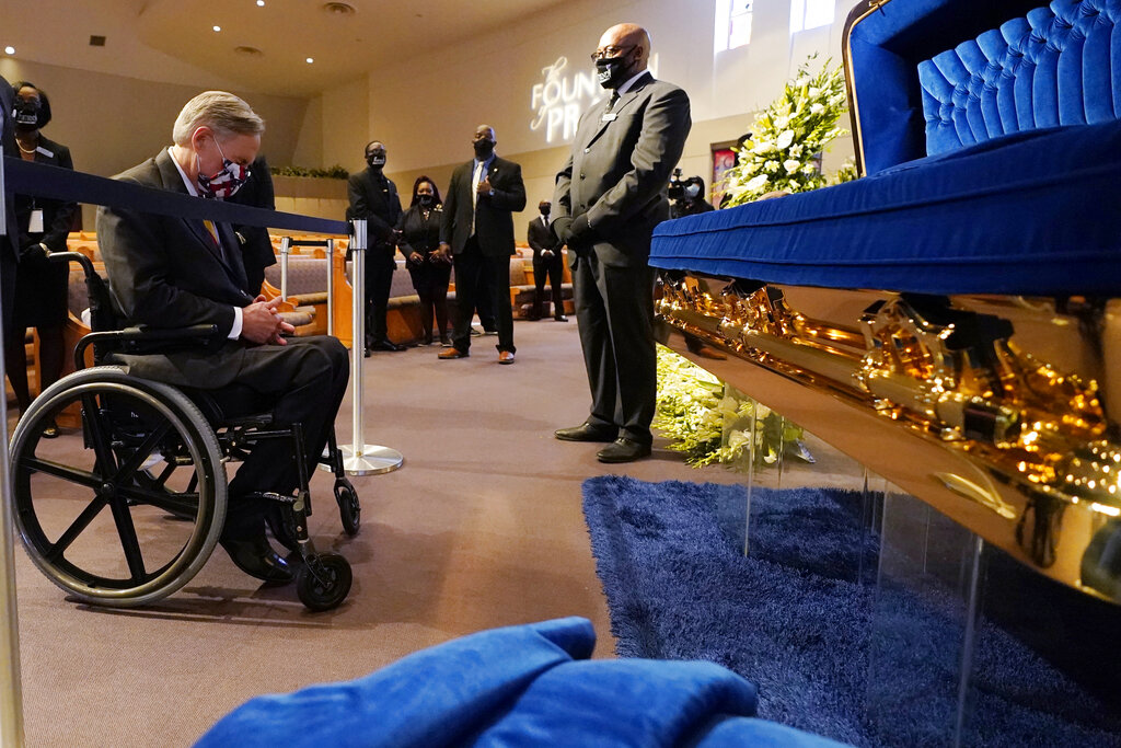 Texas Gov. Greg Abbott passes by the casket of George Floyd during a public visitation