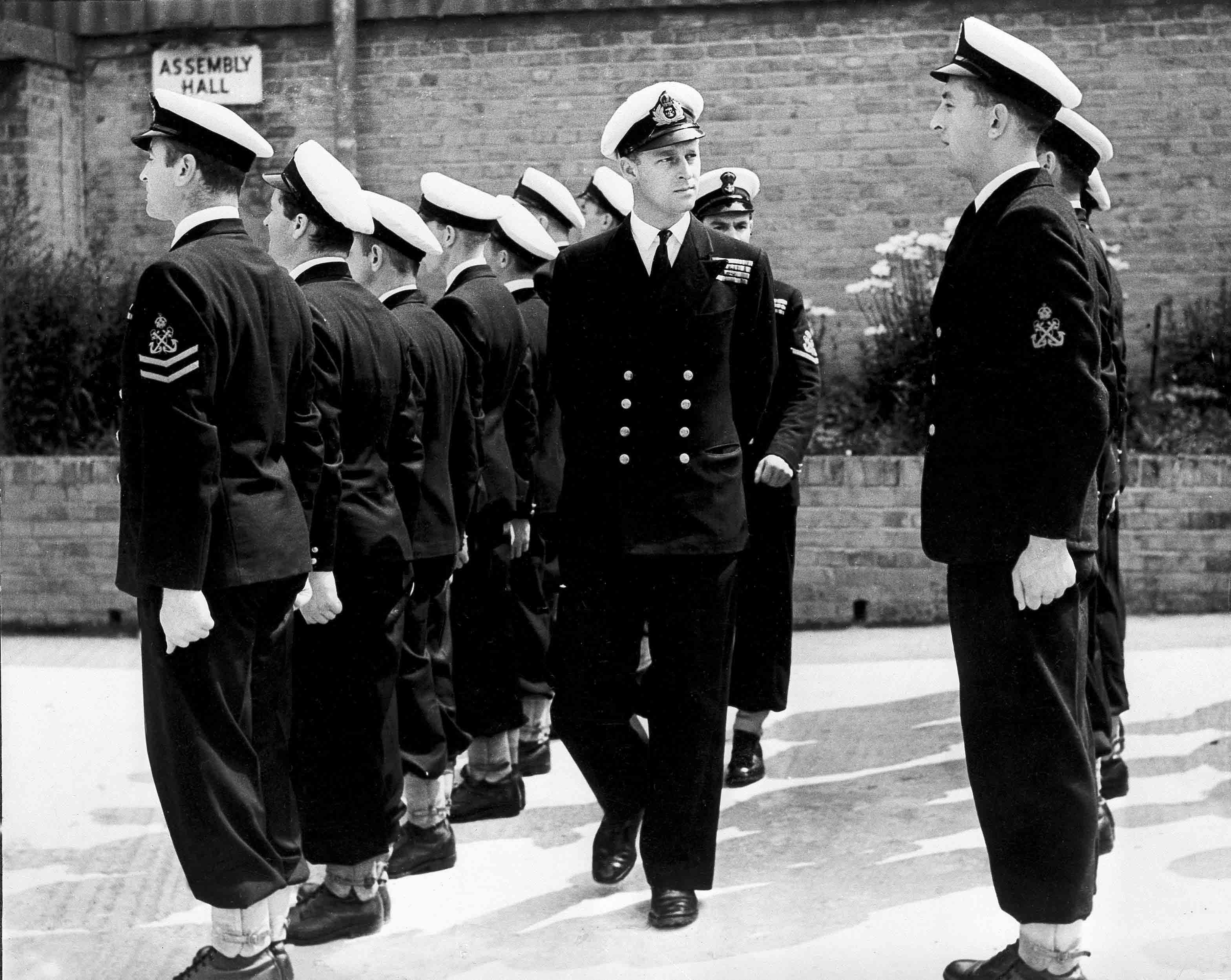 Lieut. Philip Mountbatten, as he was then called, center, inspects his men at the Petty Officers