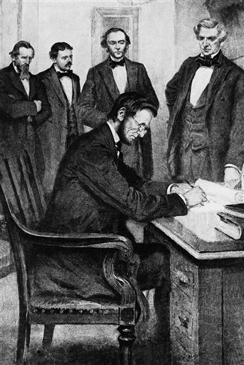 President Abraham Lincoln signs the Emancipation Proclamation, Jan. 1, 1863, in Washington