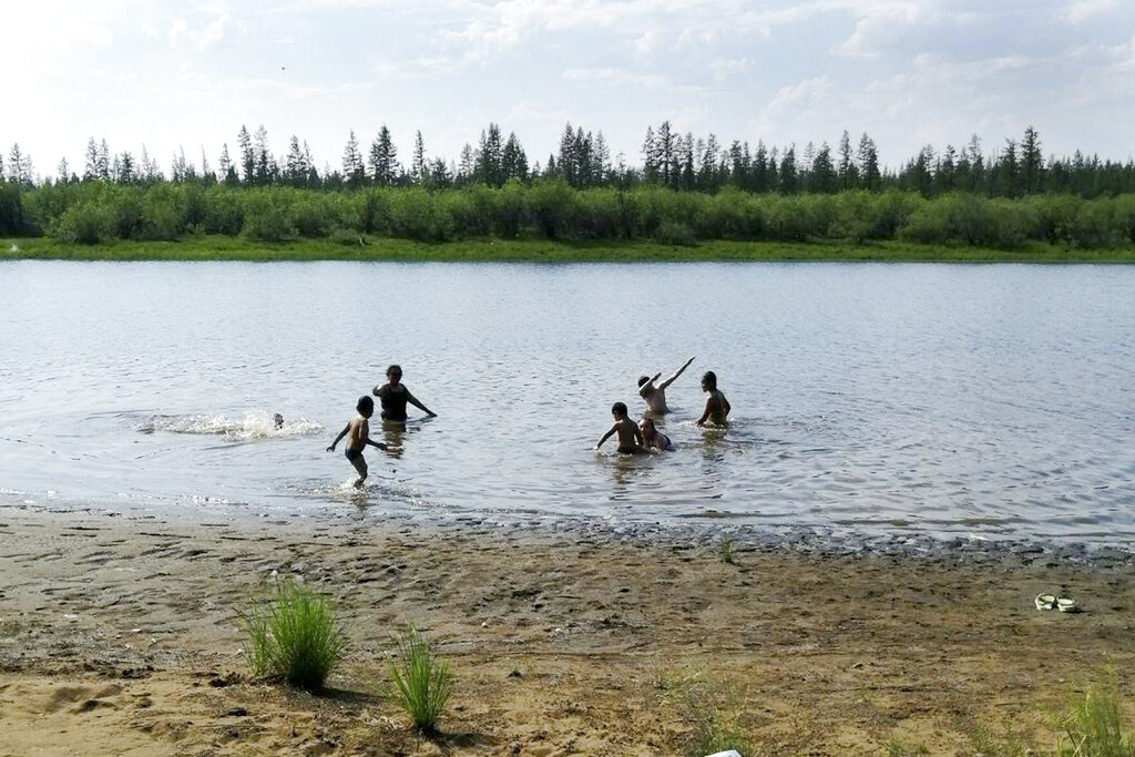Children play in the Krugloe lake outside Verkhoyansk, the Sakha Republic