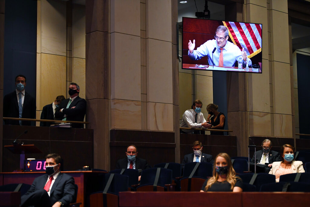 Rep. Jim Jordan, R-Ohio, seen on the monitor, gives an opening statement 