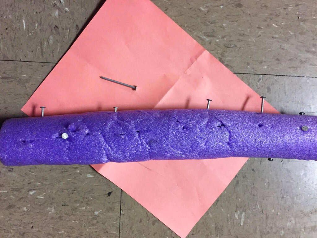 Pool noodle filled with nails that authorities say was placed on a roadway in an effort to damage police vehicle