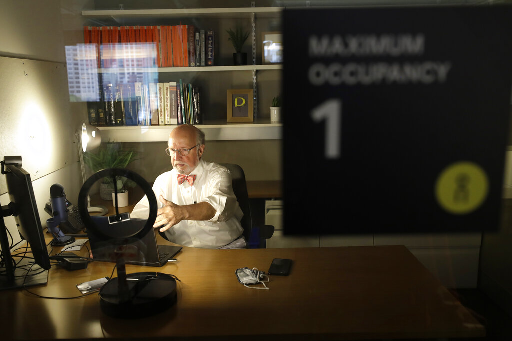President Mike Davis at the design firm Bergmeyer, arranges lighting for zoom meetings