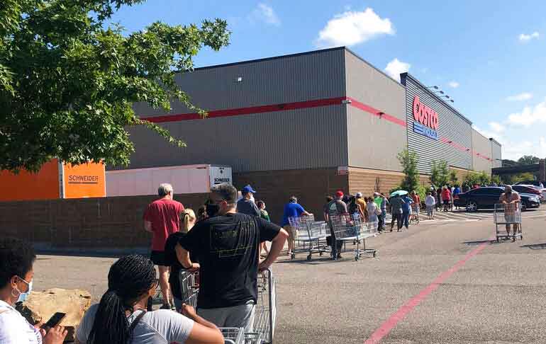 People waiting in line for Costco ahead of TS Marco 