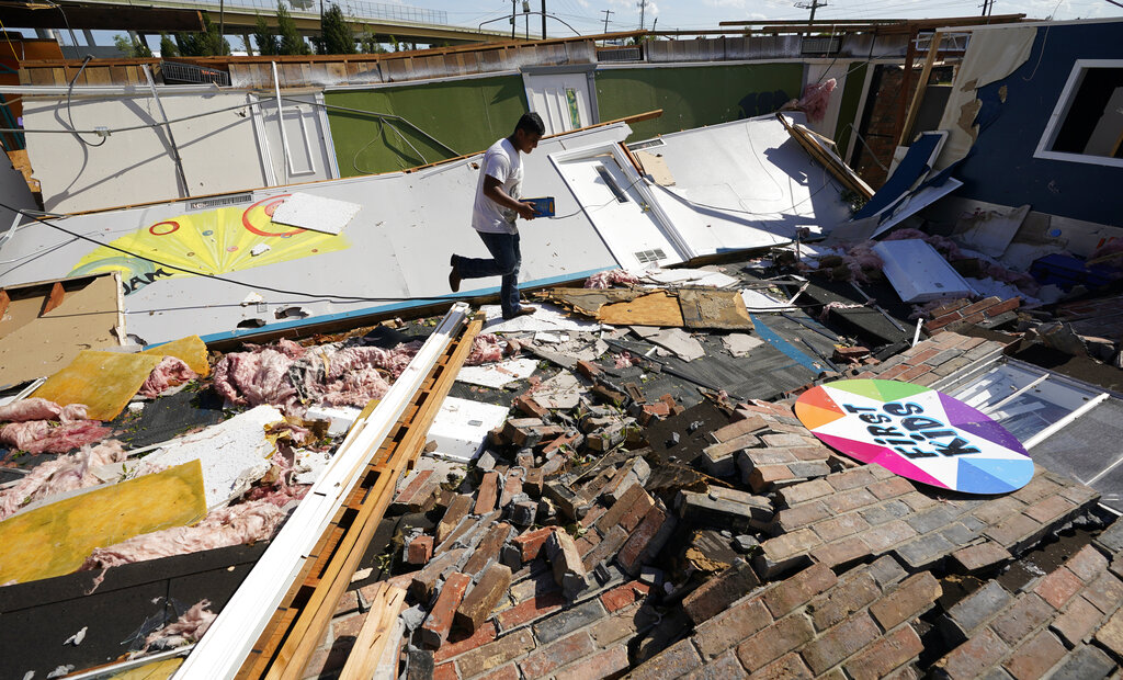 Benjamin Luna helps recover items from the children