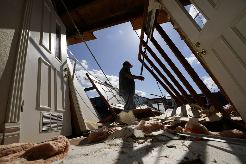 Neftali Luna surveys damages to the children