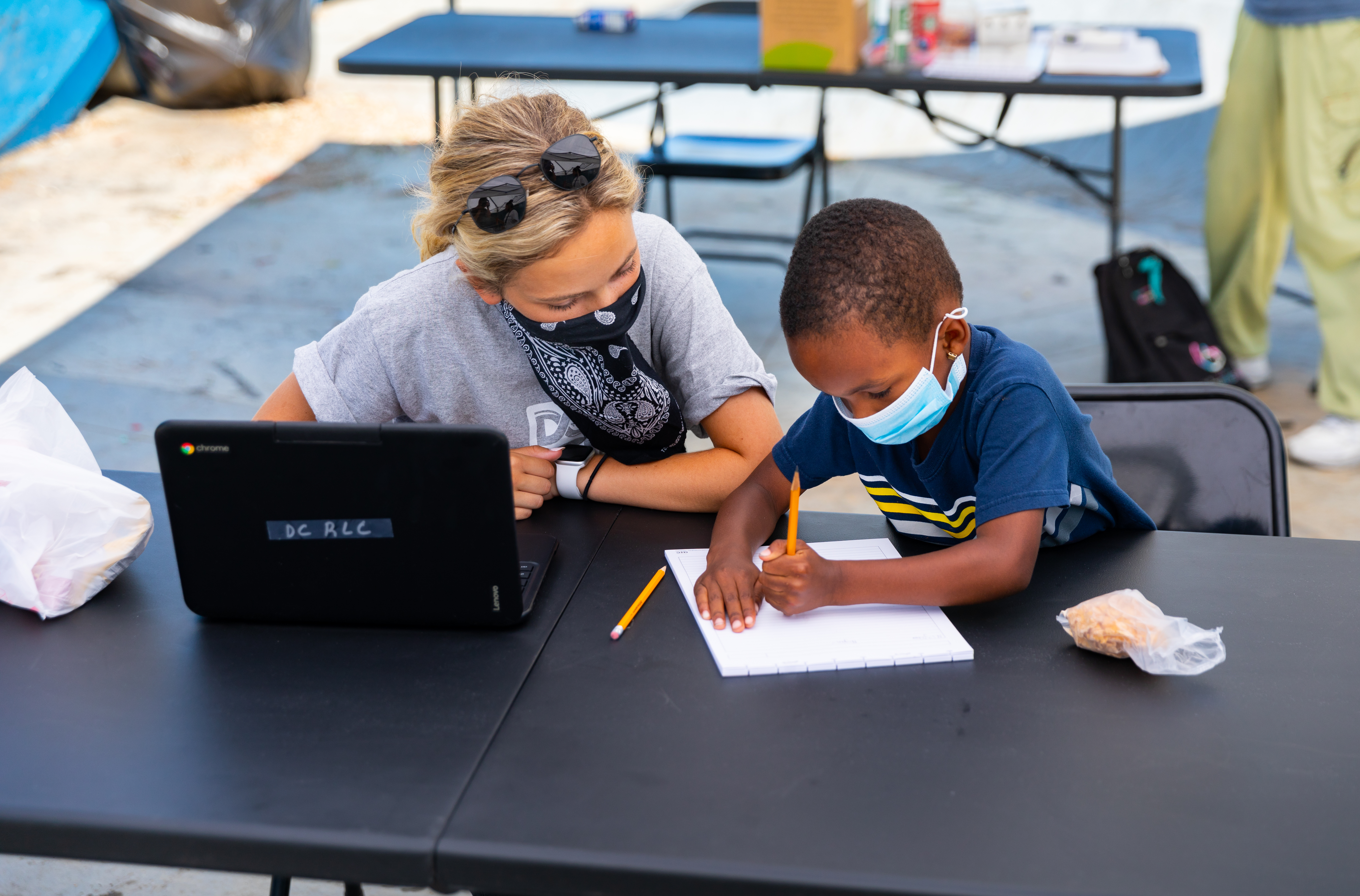 Child getting school help at the Dream Center