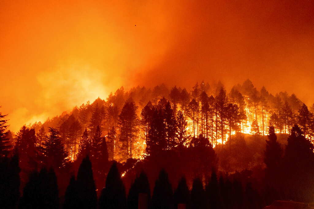 he Glass Fire burns a hillside above Silverado Trail in St. Helena, Calif.