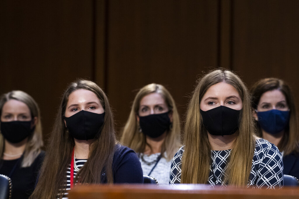 Family members of Supreme Court nominee Amy Coney Barrett listen during her confirmation hearing before the Senate Judiciary Committee