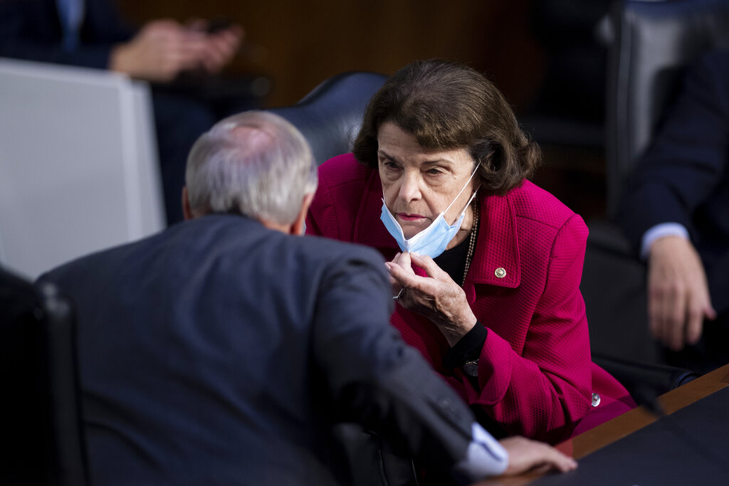 Committee chairman Sen. Lindsey Graham, R-S.C., and ranking member Sen. Dianne Feinstein, D-Calif., talk as Supreme Court nominee Amy Coney Barrett testifies