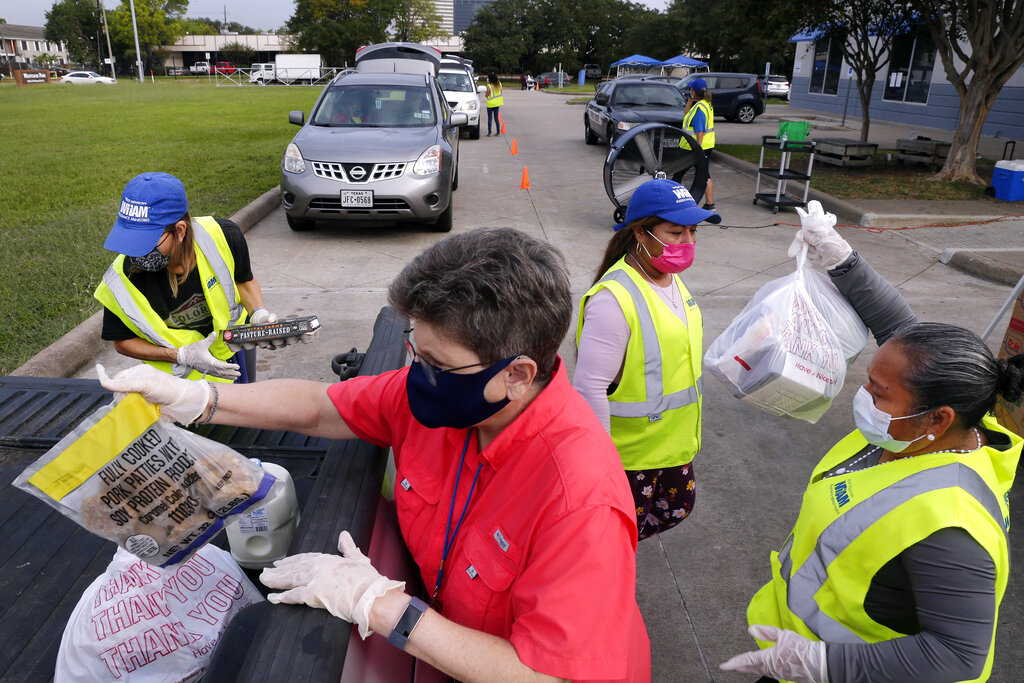 Volunteers Loading Food into Vehicles at West Houston Assistance Ministries 