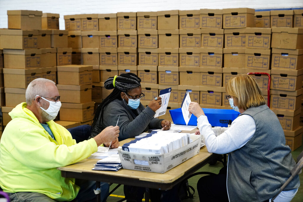 Election workers process ballots 