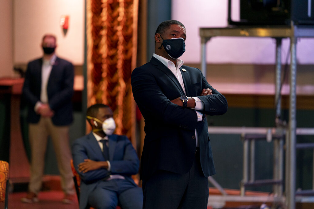Rep. Cedric Richmond, D-La., right, watches as Democratic presidential candidate former Vice President Joe Biden appears on a "Zoom with Oprah Winfrey" virtual show