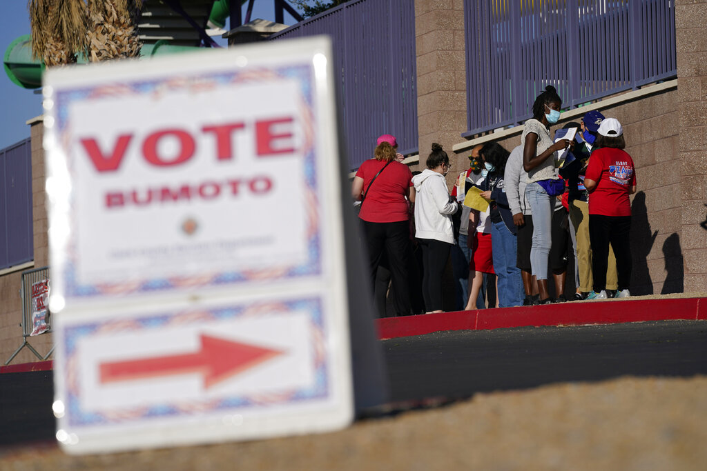 people wait in line to vote at a polling place on Election Day in Las Vegas