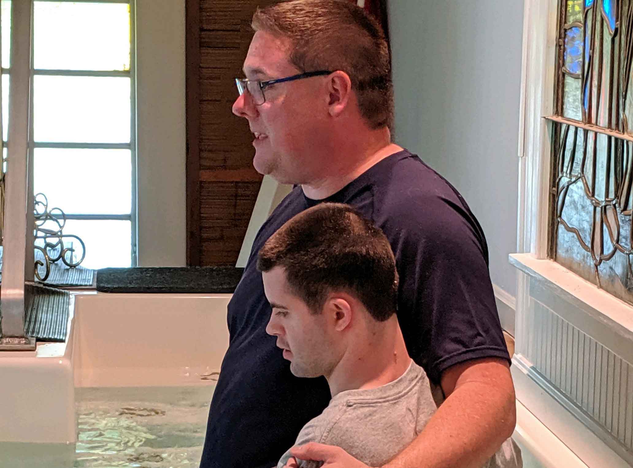 Pastor Jim baptizes young man with special needs