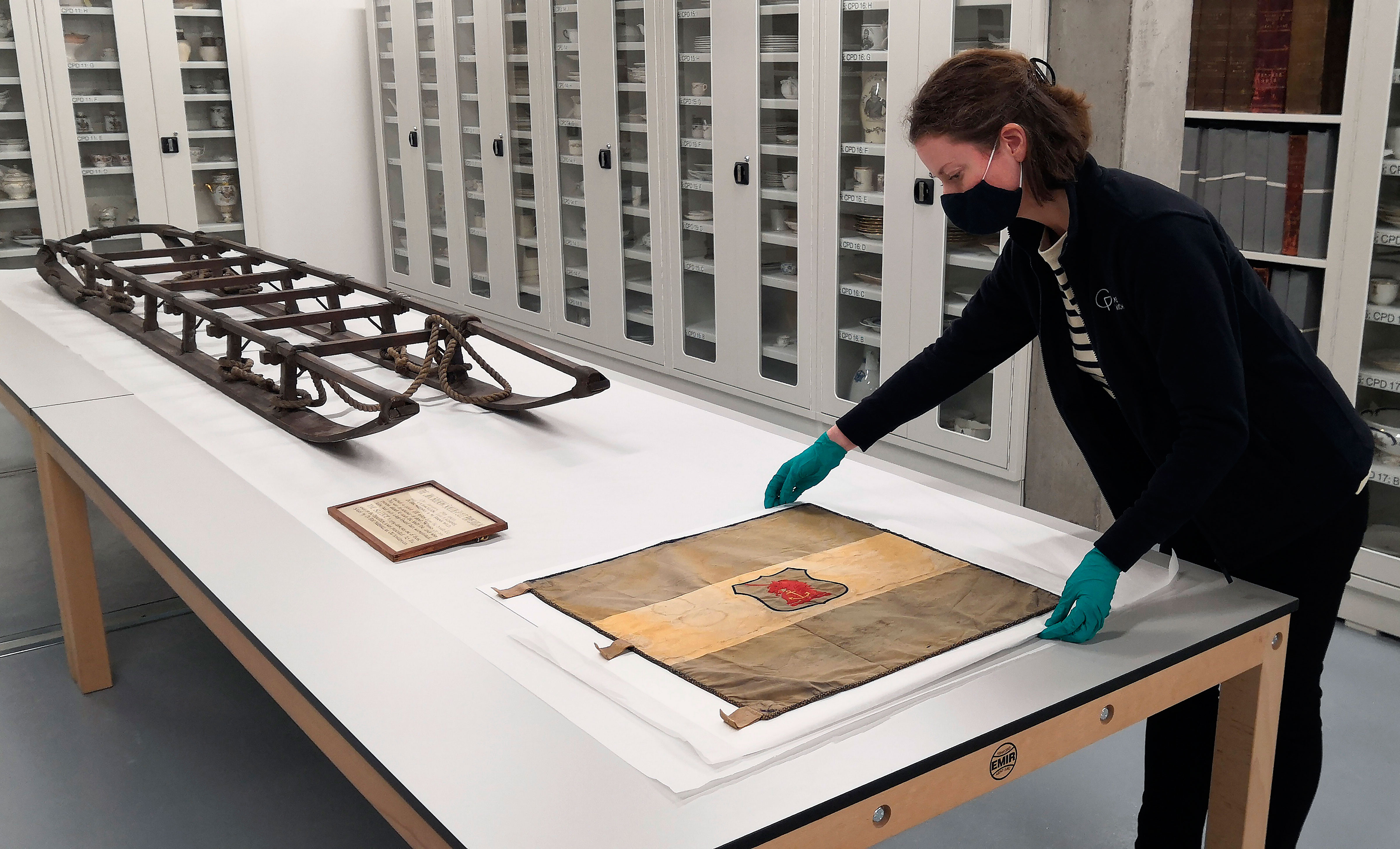 A sled and flag once used in a famed 1900s expedition to the South Pole