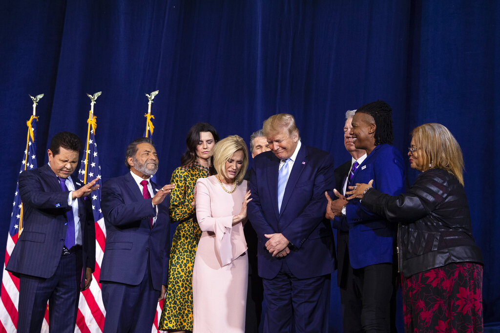 (1/3/20) Faith leaders pray over President Donald Trump during an "Evangelicals for Trump Coalition Launch" at King Jesus International Ministry in Miami.