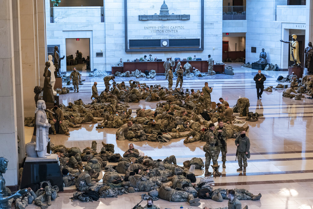 Hundreds of National Guard troops hold inside the Capitol Visitor