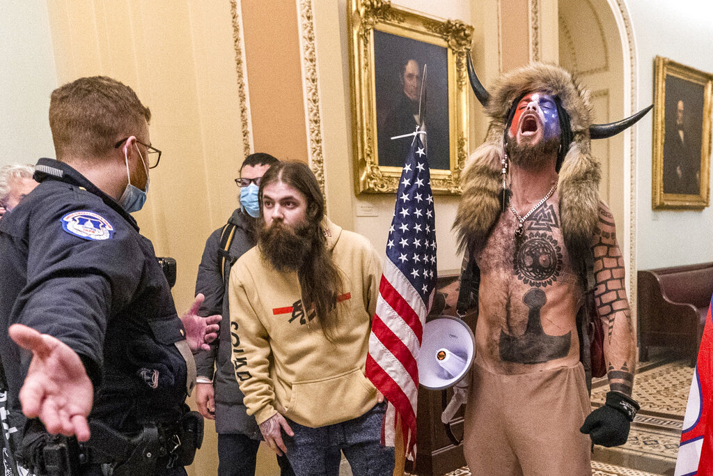 Jacob Chansley, on the right with fur hat