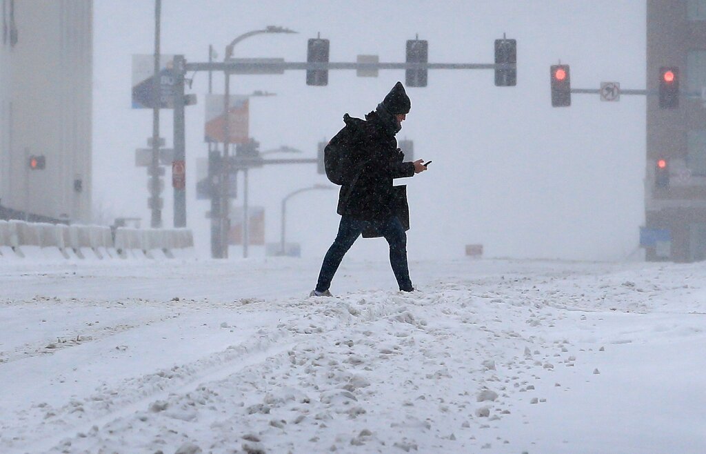 Pedestrian crosses street in St. Louis