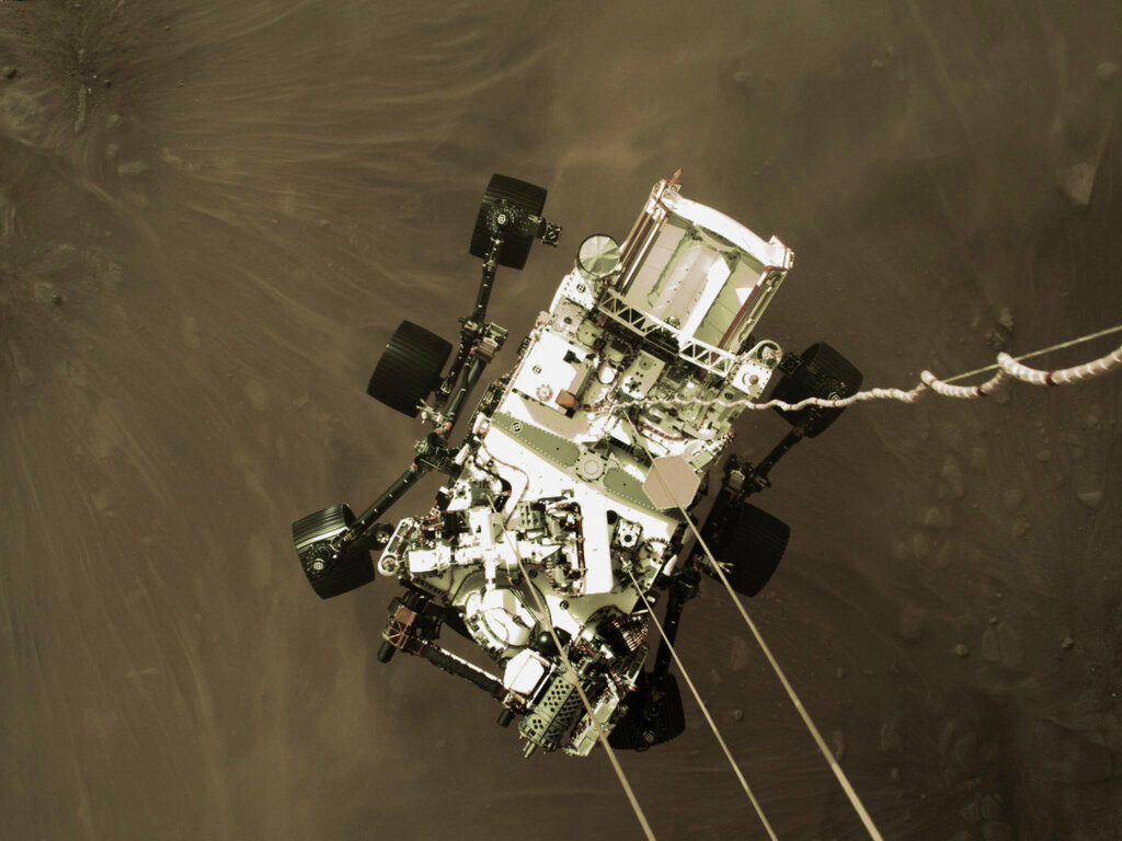 Perseverance rover lowered towards the surface of Mars during its powered descent