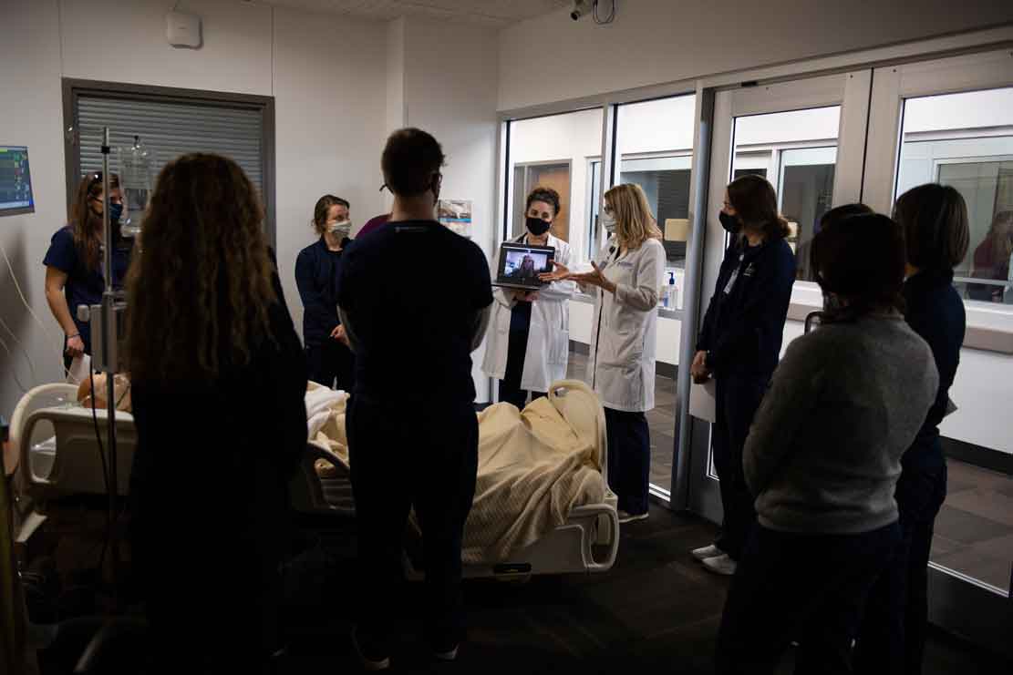 Dr. Beth Delaney from the Cedarville University School of Nursing and Dr. Michele Dodds instruct students during the group simulator program