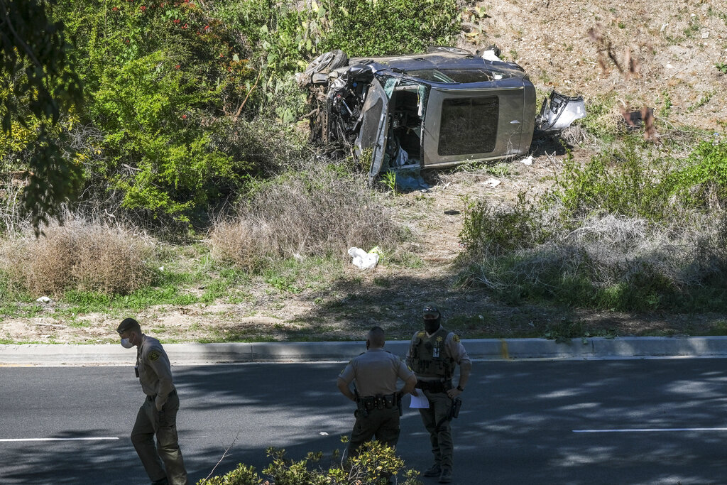 A vehicle rests on its side after a rollover accident involving golfer Tiger Woods along a road in the Rancho Palos Verdes suburb of Los Angeles