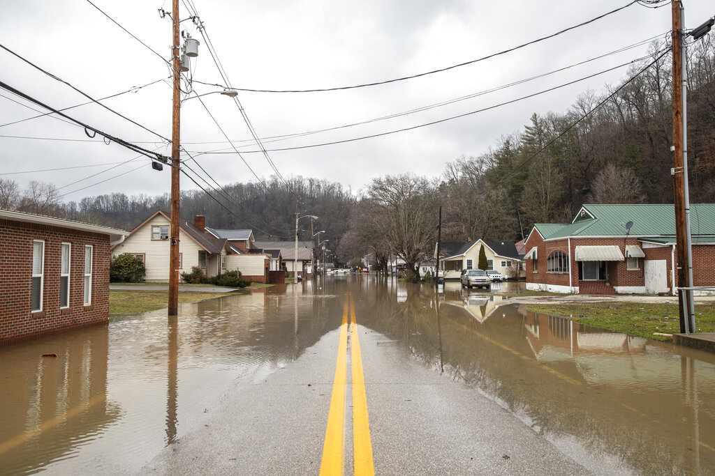 Water covers West Maple Street in Salyersville, Ky.