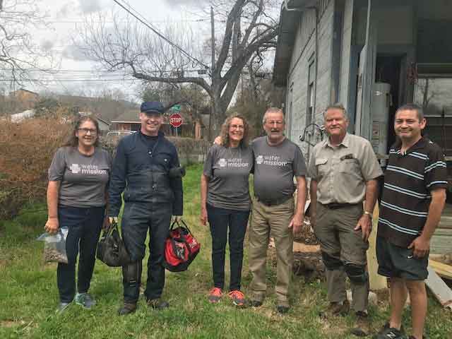 Paul and Diane Mitchell (center) with other volunteers