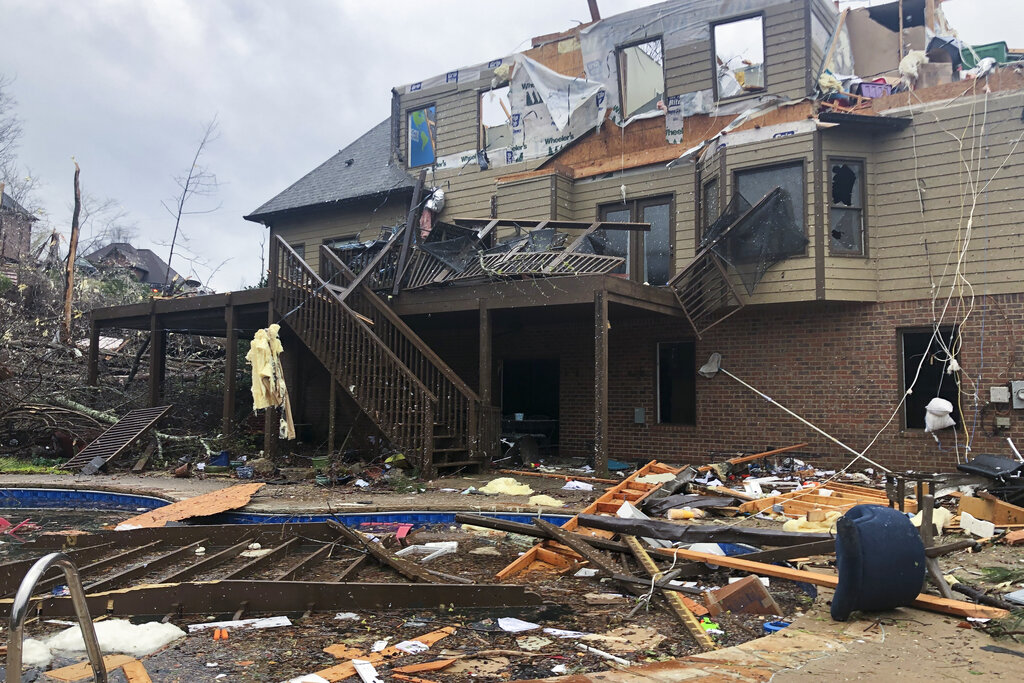 Damage is seen to a home after a tornado passed through the Eagle Point subdivision near Birmingham, Ala. 