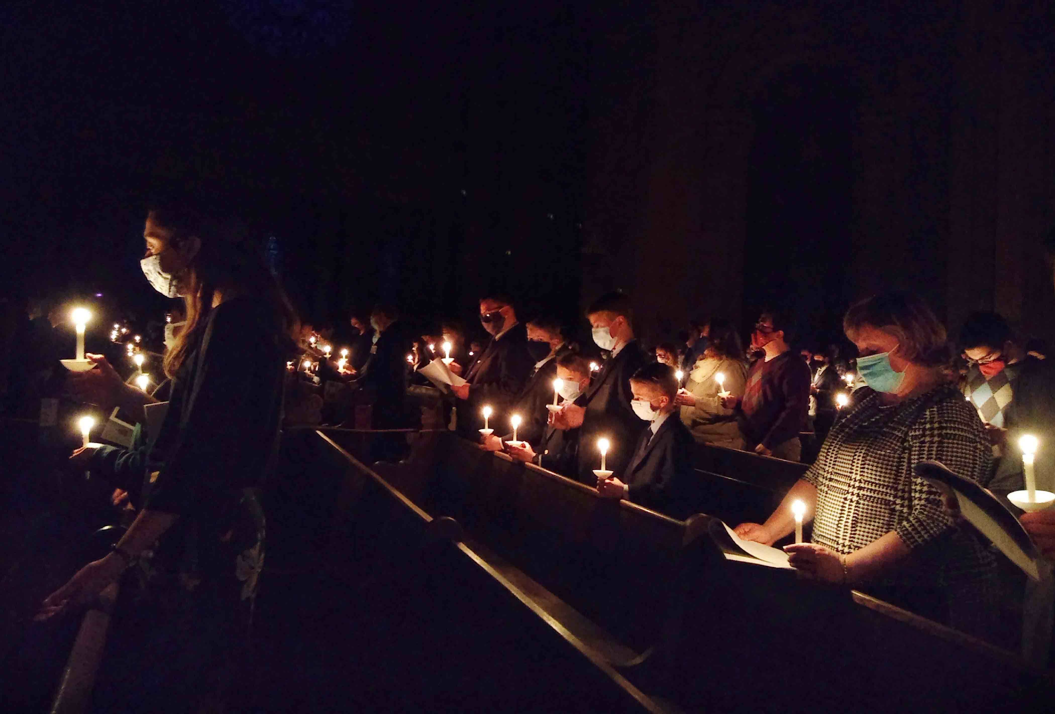 Catholic faithful gather in the Cathedral of St. Paul in St. Paul, Minn., for the beginning of the solemn celebration of the Easter Vigil.