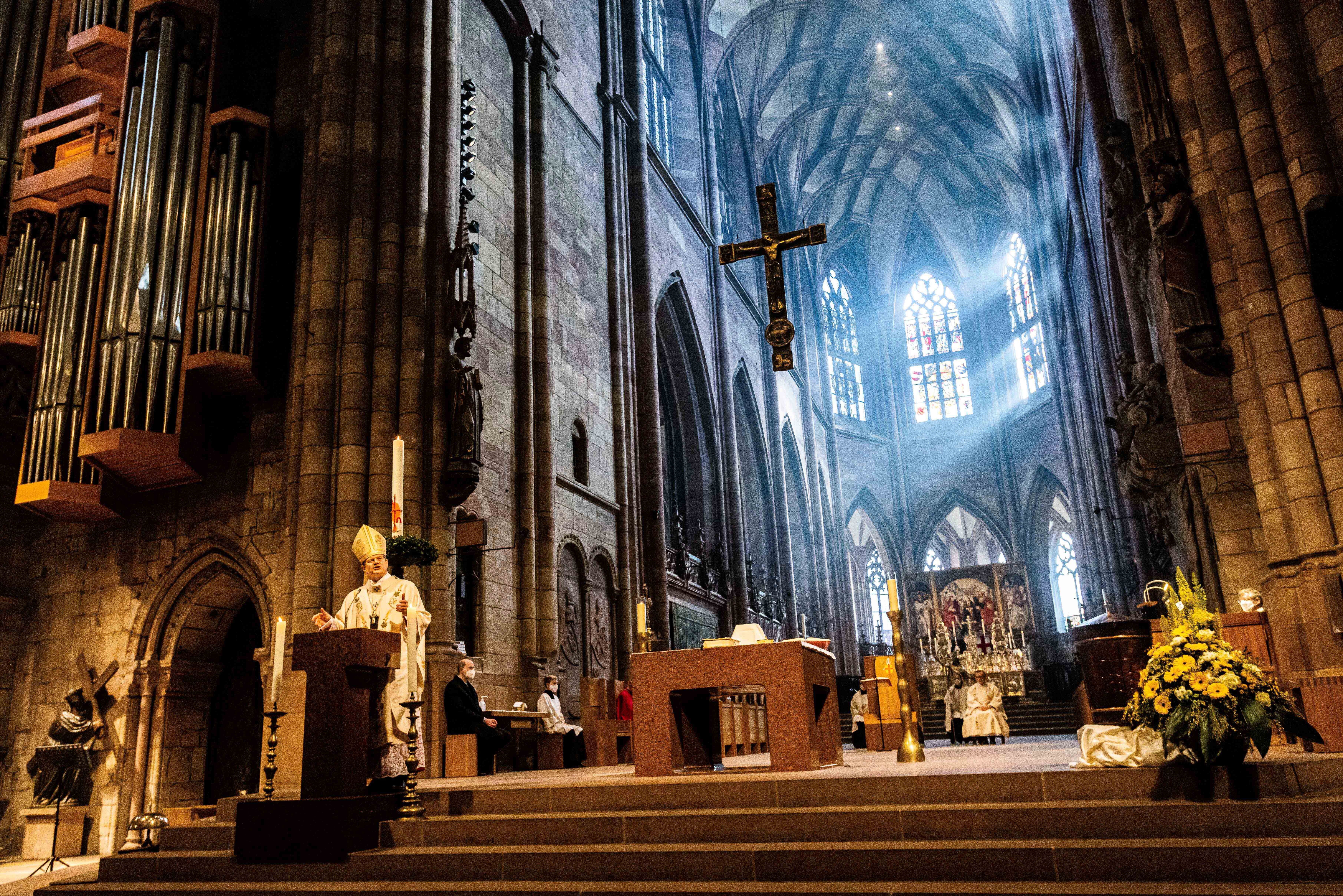 Archbishop Stephan Burger speaks to the faithful during the Pontifical Mass for Easter Sunday in Freiburg Cathedral in Freiburg, Germany, Sunday, April 4, 2021.