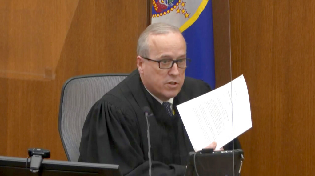 Hennepin County Judge Peter Cahill reads instructions to the jury before closing arguments