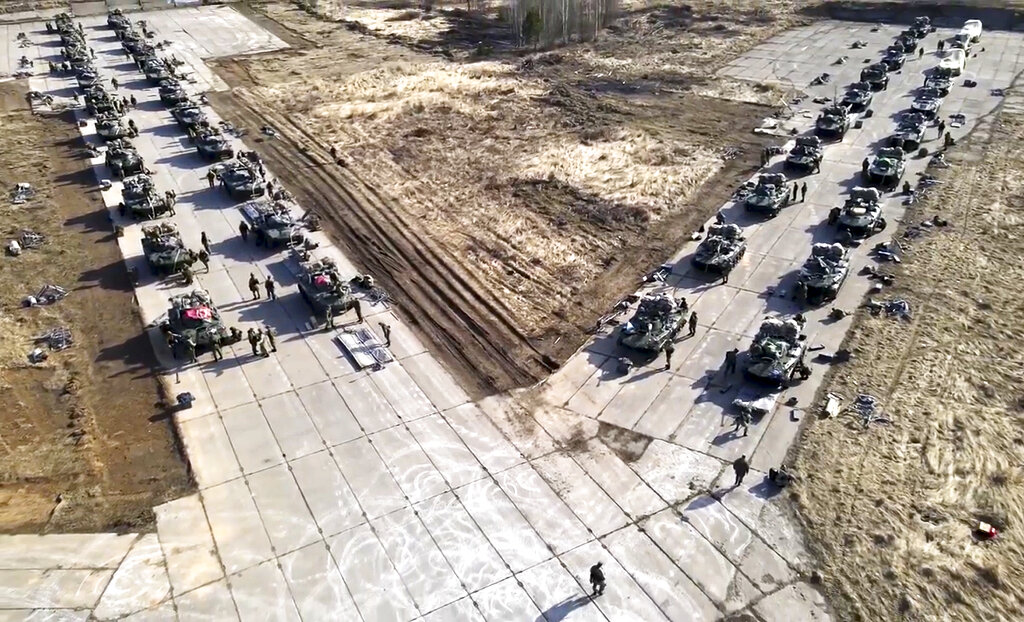 Russian military vehicles move during drills in Crimea