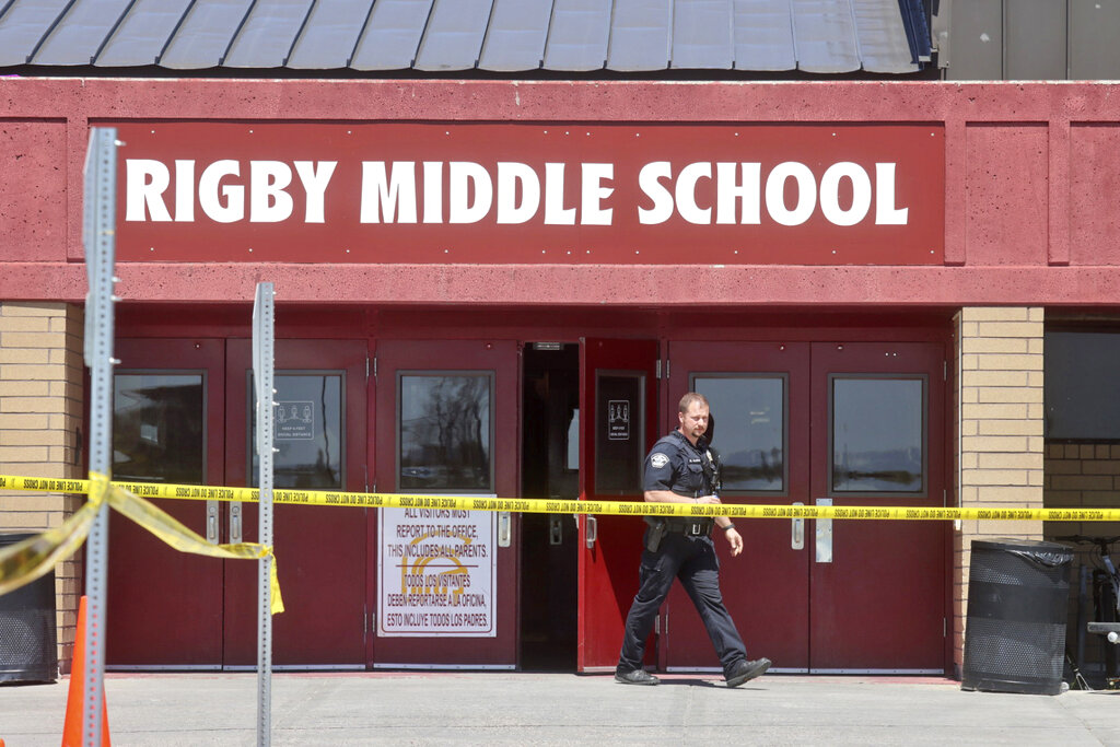 Police officer walks out of Rigby Middle School