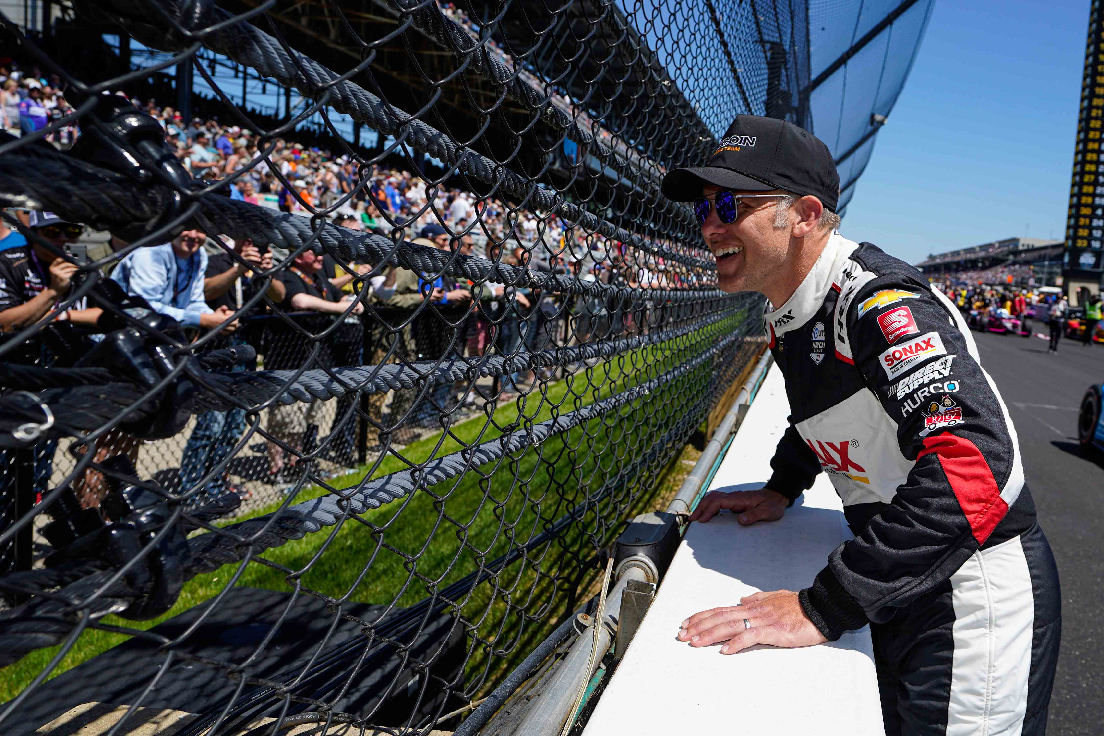 Ed Carpenter talks with fans through the fence before the Indianapolis 500 auto race at Indianapolis Motor Speedway in Indianapolis, Sunday, May 30, 2021.