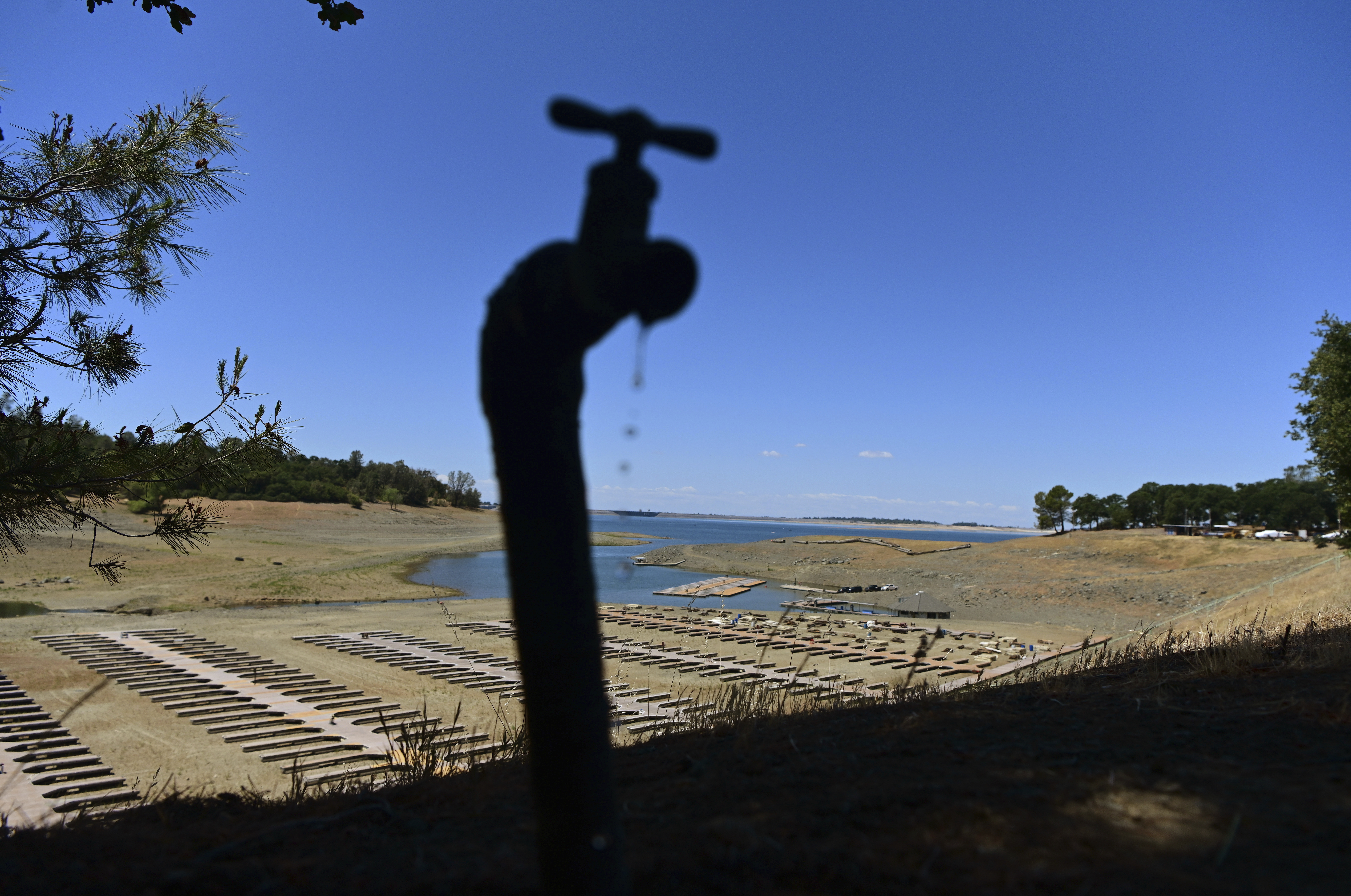 Water dripping from faucet near dry boat dock
