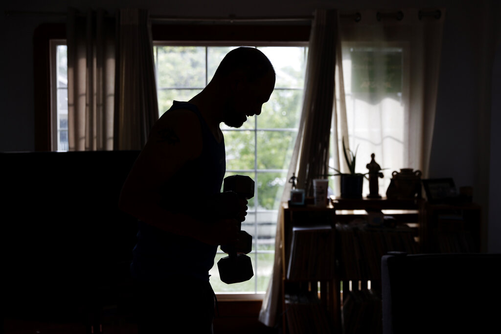 Christian Hainds works out at his home in Hammond, Ind.