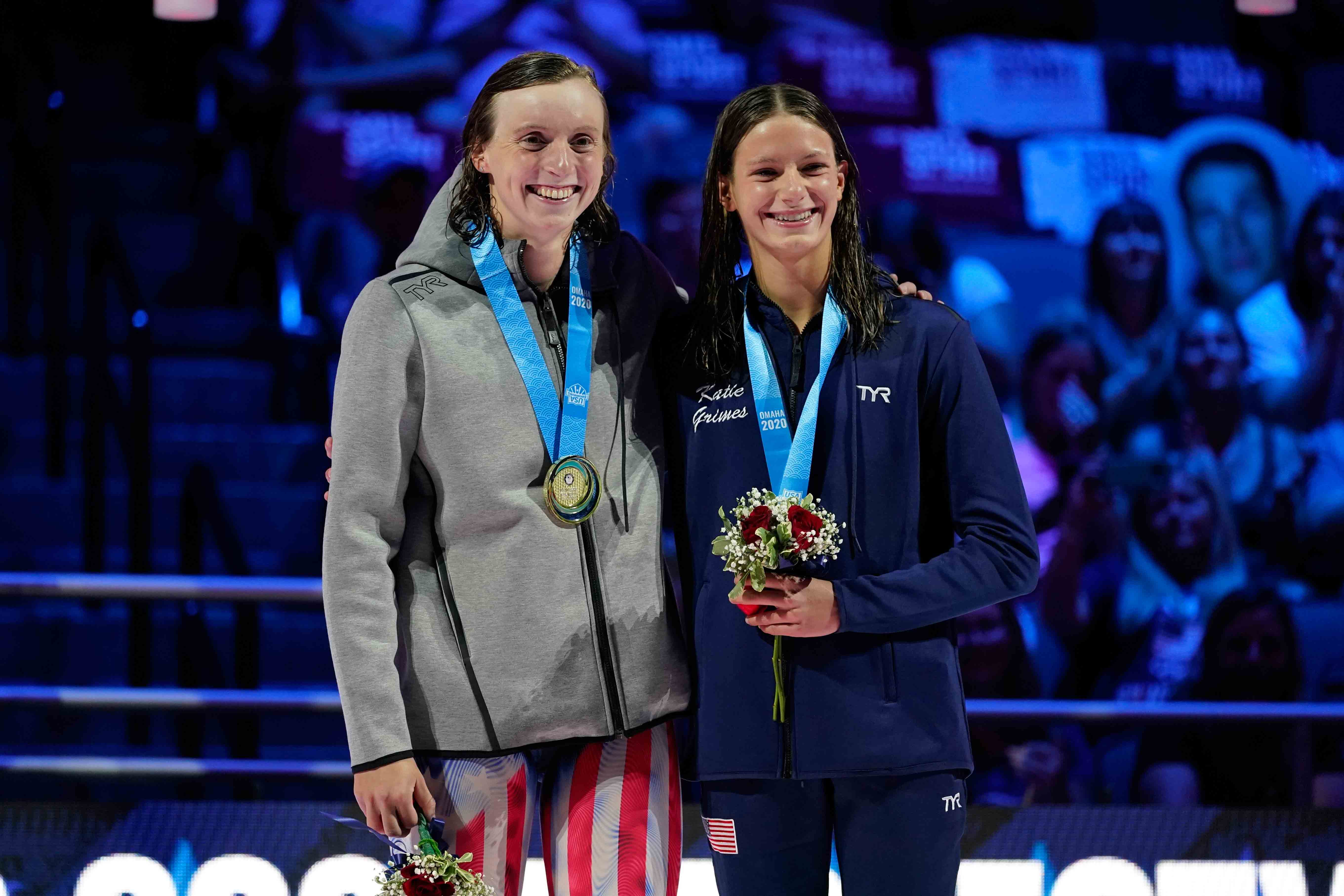 Katie Ledecky and Katie Grimes on the podium at the medal ceremony for the women