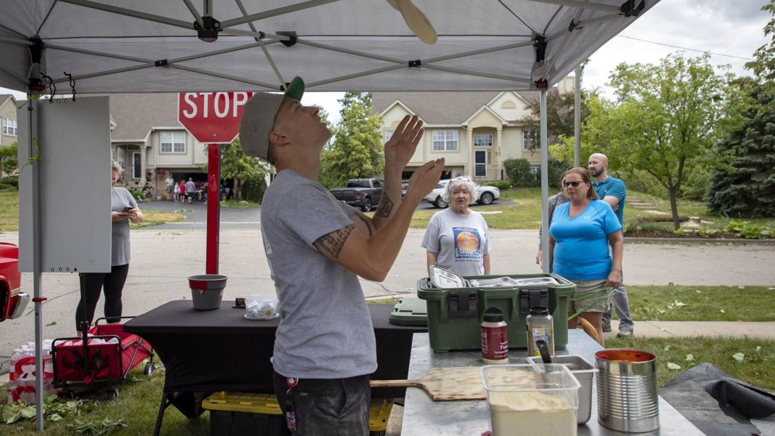 Brian Rock makes pizza