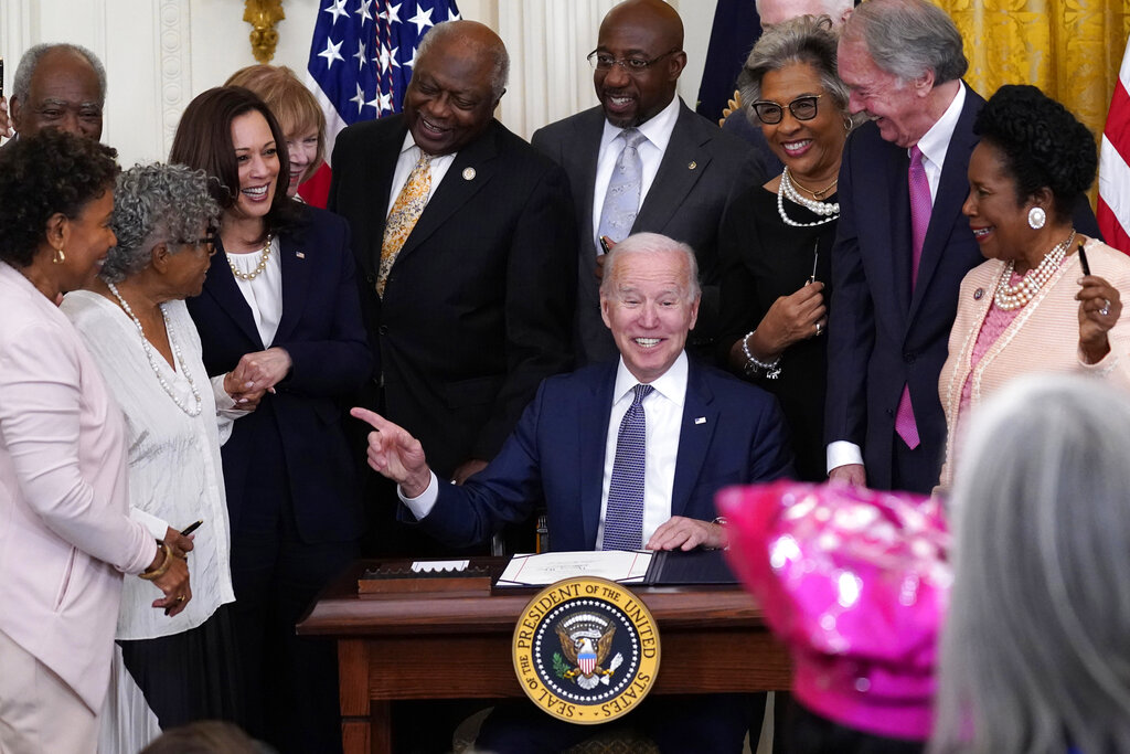 President Joe Biden points to Opal Lee after signing the Juneteenth National Independence Day Act, in the East Room of the White House 