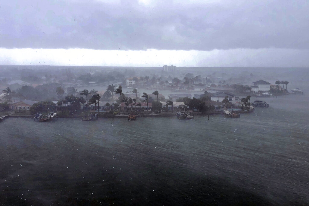 Looking north at the neighborhood of Paradise Island on Treasure Island, Fla., outer bands of Tropical Storm Elsa brings a downpour of rain over the area