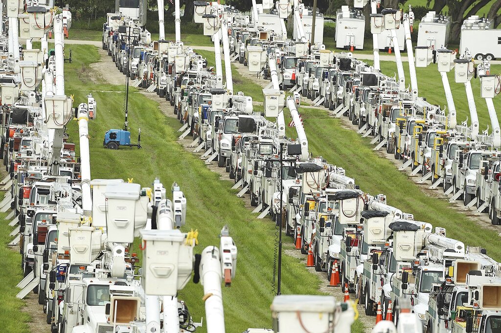 250 electrical utility trucks are lined up at Duke Energy