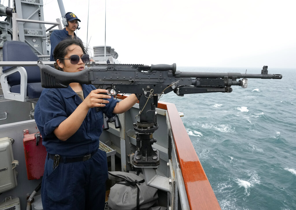 US Navy sailor of the destroyer USS Ross, Christina Cortez from San Diego, California, prepares a machine gun, during Sea Breeze 2021 maneuvers, in the Black Sea